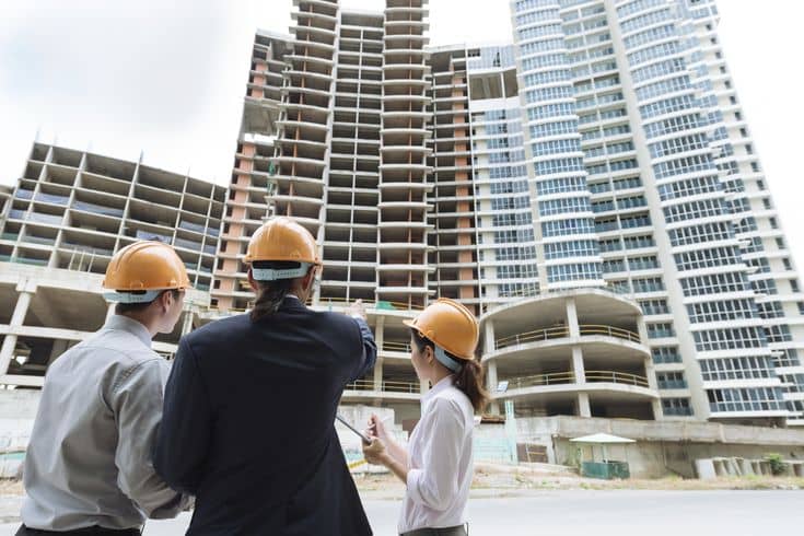building inspectors looking at a building